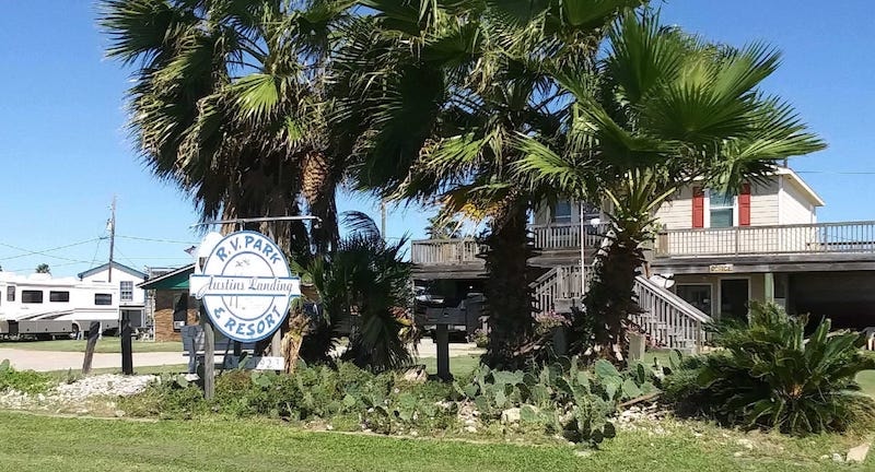 Austin's Landing RV Park entrance sign with palm trees